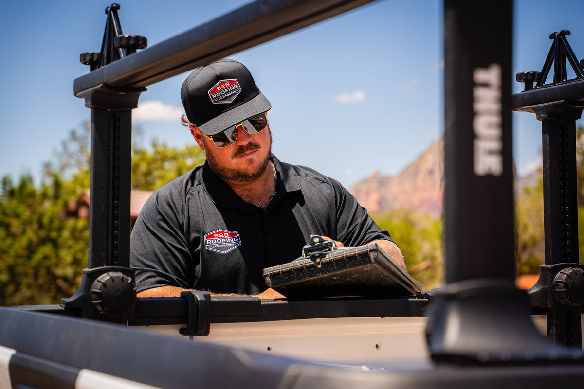 928 Roofing team member working beside a truck in Sedona
