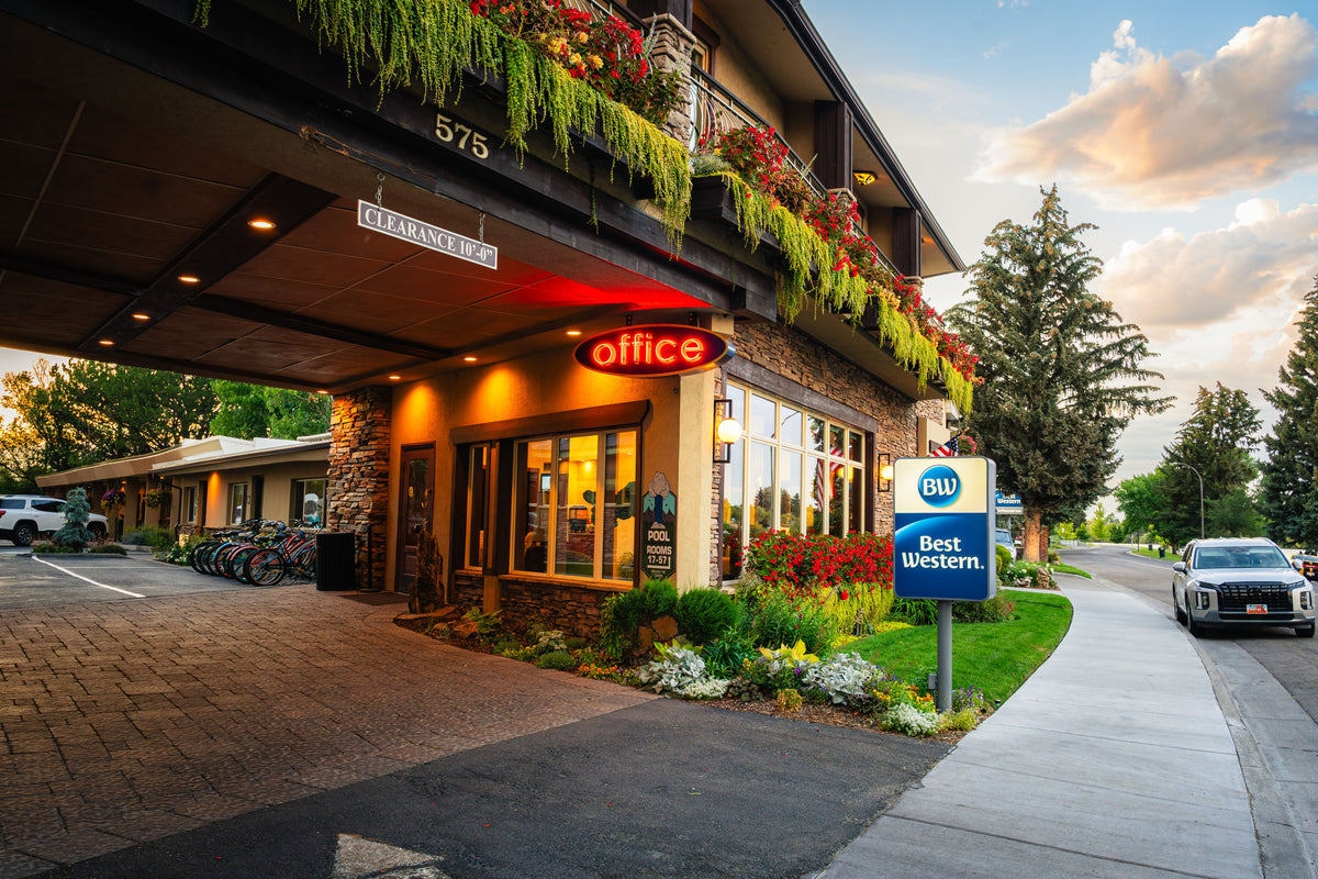 Driftwood Inn entrance in Idaho Falls with hanging flowers and warm evening light