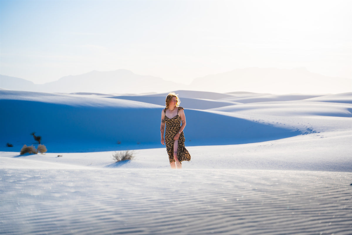 Traveler standing among the white dunes of New Mexico