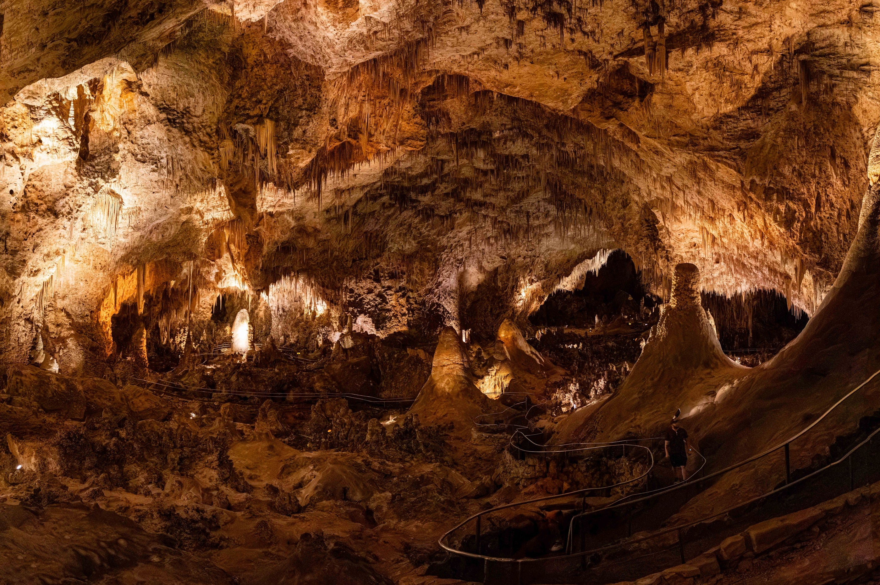 A wide illuminated chamber and formations inside Carlsbad Caverns