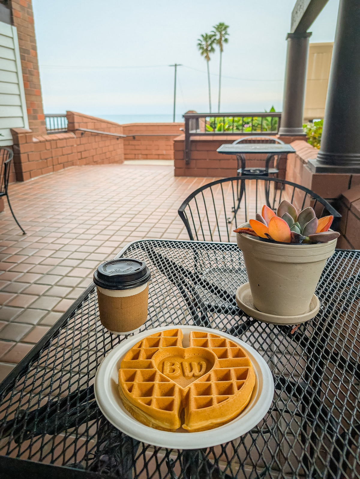Breakfast with a waffle and coffee on the hotel deck in Dana Point