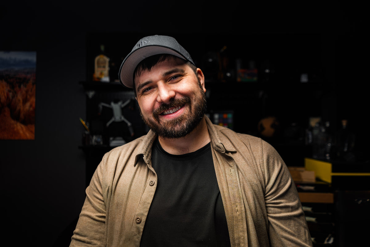 Tyler Barks smiling in his photography studio